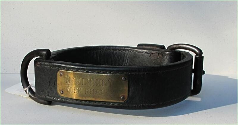 Two 19thc leather Dog Collars along with cast iron Dog bone shape door stop GC3A