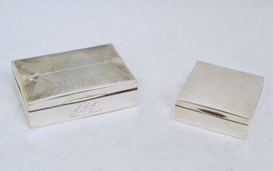Two silver cigarette boxes, the larger rectangular example designed with engine turned lid, c.1931, James Dixon & Sons, 9 x 13.1cm, the smaller square example Birmingham, 1936, Hasset & Harper, 8.6 x 8.6cm, both with wood lined interiors...