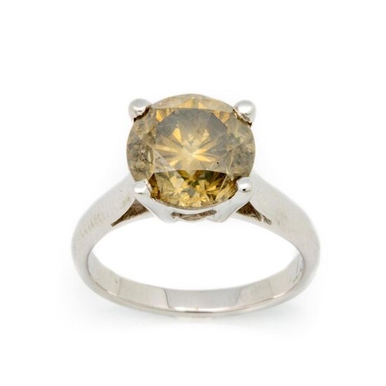 White gold ring with a solitaire golden yellow diamond weighing 4.03 cts