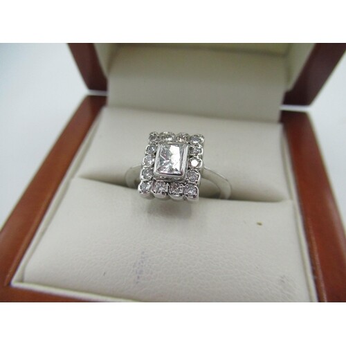 White metal and diamond ring with princess cut diamond and h...