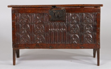 16th Century oak coffer, of small proportions, the rectangular top boards above the profusely carved