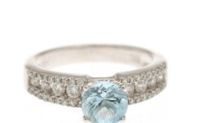 1927/1120 - An aquamarine and diamond ring set with a circular-cut aquamarine flanked by numerous brilliant-cut diamonds, mounted in 18k white gold.