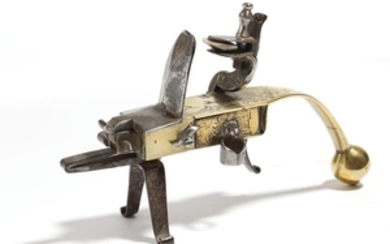 An 18th century brass and steel flintlock tinder p…