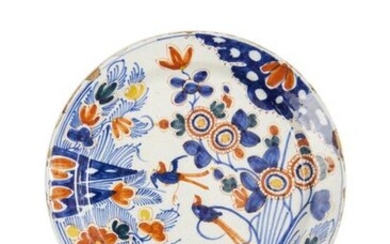 20-Delft: a polychrome earthenware dish depicting birds in a flowery...