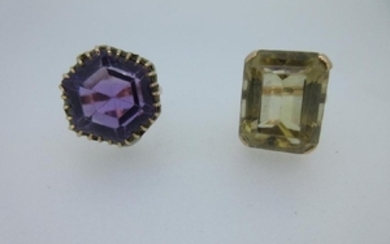 An amethyst dress ring and a similar citrine ring