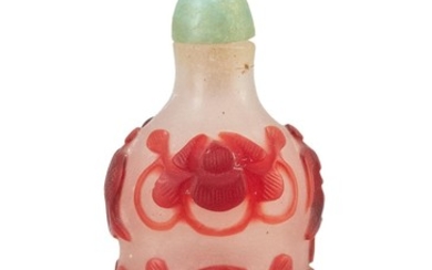 CHINESE OVERLAY GLASS SNUFF BOTTLE In spade shape, with red overlay pahua design on an opalescent ground. Height 2.3". Green glass s...