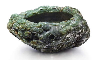 A MASSIVE INSCRIBED SPINACH-GREEN JADE 'DRAGON' WASHER QING DYNASTY