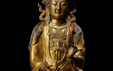 A rare gilt-bronze figure of Guanyin