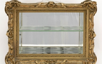 GILT, GESSO AND WOOD SHADOW BOX Ornate frame. Mirrored interior with single shelf. Height 19". Width 23". Depth 8".