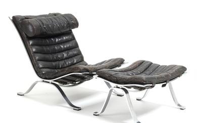 Arne Norell: “Ari”. Easy chair and matching stool with frame of steel. Seat and back upholstered with black leather. (2)