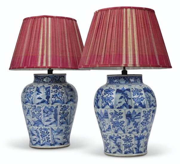 TWO CHINESE BLUE AND WHITE BALUSTER VASES, KANGXI PERIOD (1662-1722), MOUNTED AS LAMPS, THE SHADES BY ROBERT KIME LTD.