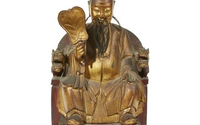 A Chinese carved and gilt-lacquered wood figure of a