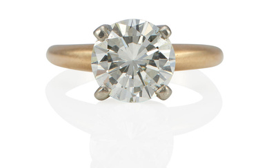 A 14K BI-COLOR GOLD AND DIAMOND SOLITAIRE RING