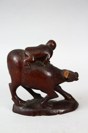 A 19TH CENTURY CHINESE CARVED CHERRYWOOD FIGURE OF AN