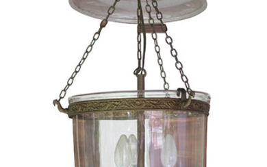 A 19th century European clear glass hall lantern with brass mounts