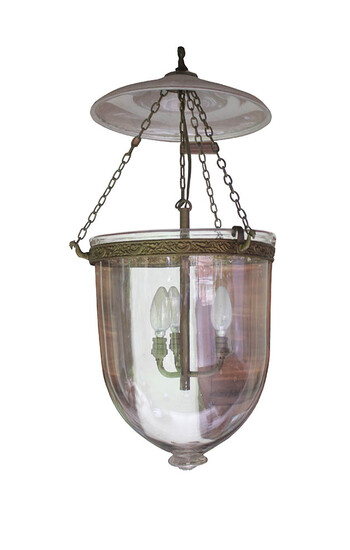 A 19th century European clear glass hall lantern with brass mounts