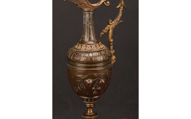 A 19th century Grand Tour ewer, cast with flowers and foliag...