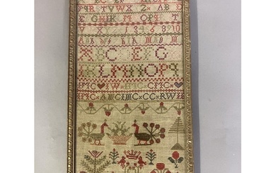 A 19th century needlework sampler worked in bands of the alp...