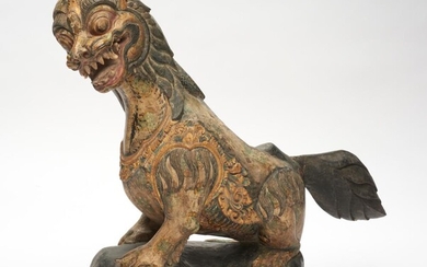 A BALINESE CARVED FIGURE OF A LION 19TH CENTURY