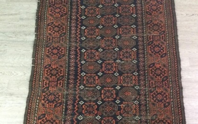 A BELOUCH BORDERED RUG