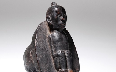 A Batak Pupuk horn cover with figure.