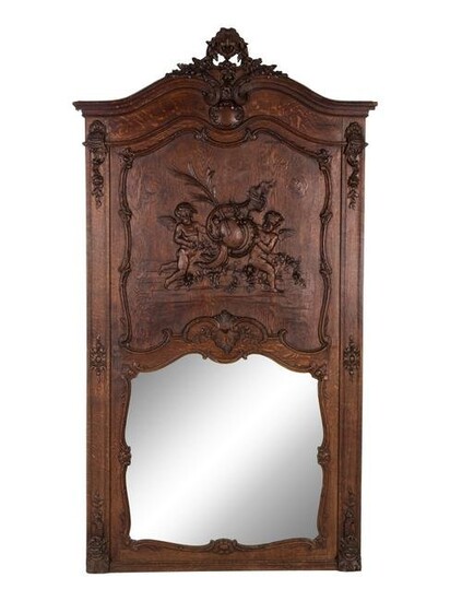 A Belgian Louis XV Style Carved Oak Trumeau Mirror