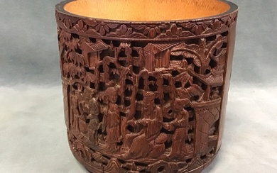 A C19th Chinese bamboo brush pot carved with panels of...