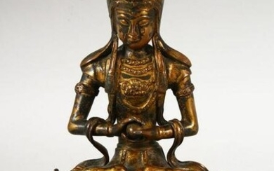 A CHINESE GILT BRONZE FIGURE OF BUDDHA / DEITY - in a