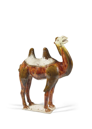 A CHINESE SANCAI-GLAZED POTTERY LARGE FIGURE OF A CAMEL, TANG DYNASTY (618-907)