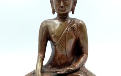 A Chinese Bronze Seated Buddha Figure. 20cm tall. 16cm...