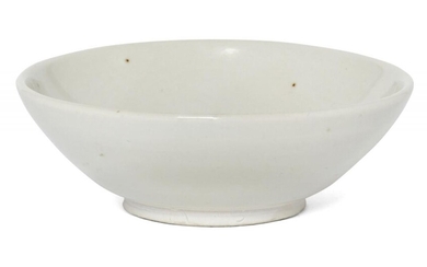 A Chinese Xing white-glazed bowl, Tang dynasty, the shallow, thickly...