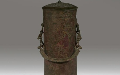 A Chinese archaic bronze cylindrical covered vessel