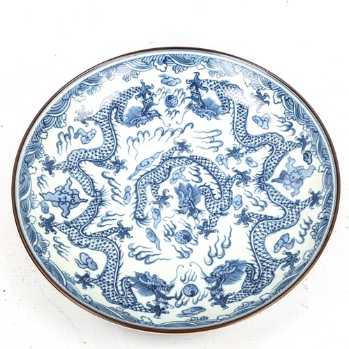 A Chinese blue and white porcelain dragon bowl, 6 character ...