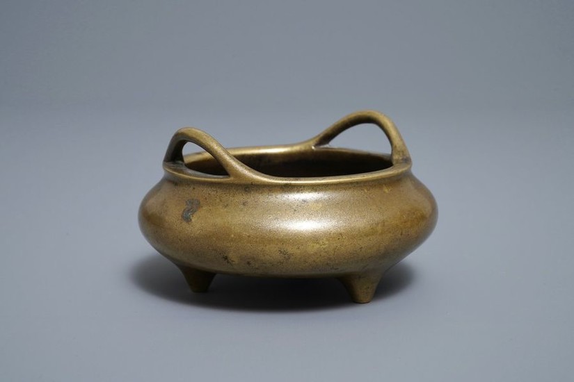 A Chinese bronze tripod incense burner, Xuande mark,...