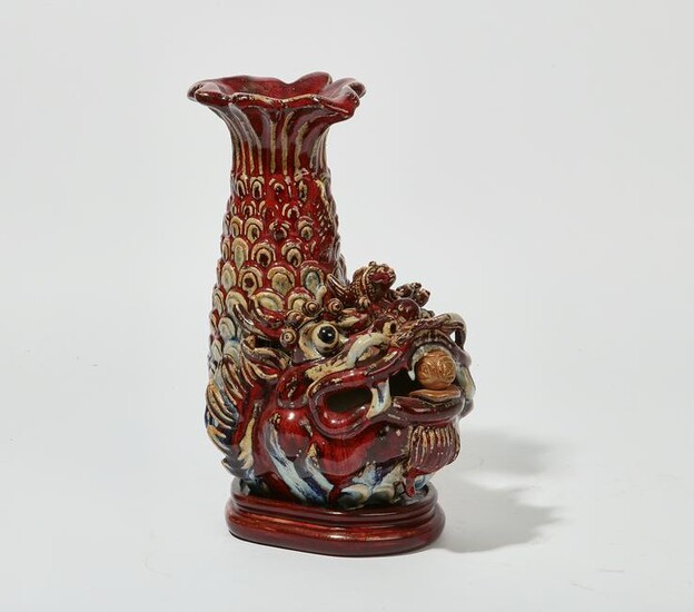 A Chinese glazed pottery dragon fish vase