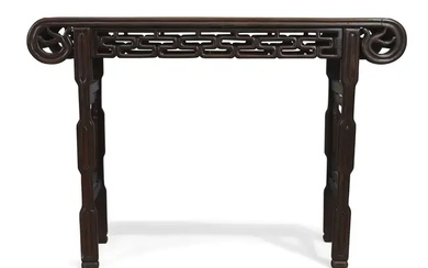 A Chinese hardwood altar table 20th century The rectangular top with scroll...