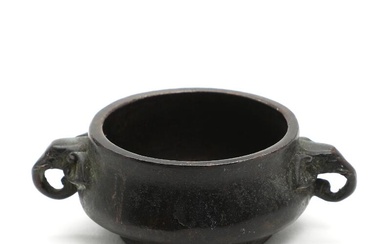 A Chinese patinated bronze censer with elephant handles. Weight app. 365 g....