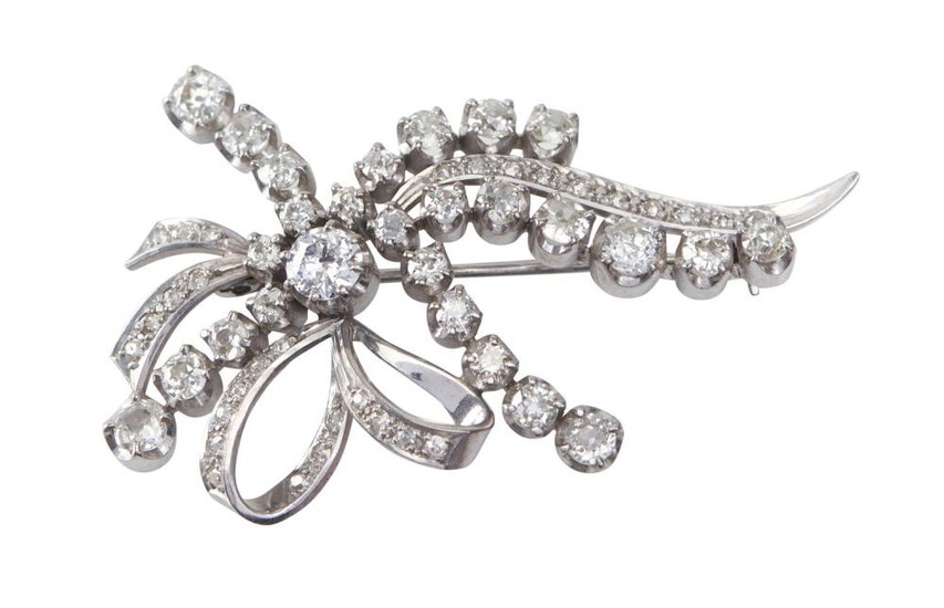 A DIAMOND BROOCH - Of bow design, set with old European cut diamonds totalling 4.10cts, in 18ct white gold.