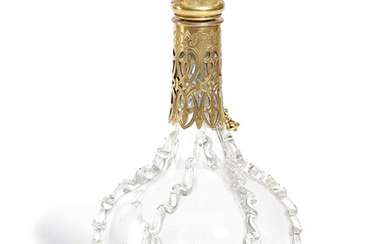 A FRENCH GILT METAL MOUNTED GLASS DECANTER AND STOPPER