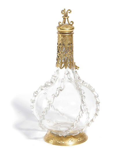 A FRENCH GILT METAL MOUNTED GLASS DECANTER AND STOPPER