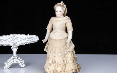 A French fixed shoulder-head fashionable doll with painted eyes
