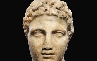 A GREEK MARBLE HEAD OF A YOUTH, CIRCA MID 4TH CENTURY B.C.