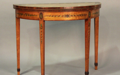 A George III satinwood fold-over demi-lune card table, the crossbanded top painted with a border of