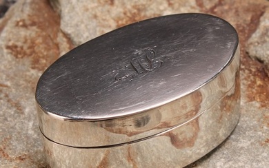 A George III silver oval nutmeg grater, quite plain, hinged ...