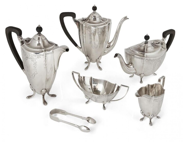 A George VI five-piece silver tea set , Birmingham, c.1950, Barker Brothers, comprising tea pot, coffee pot, hot water pot, sugar and milk, together with an associated pair of Victorian silver sugar nips, the Barker Bros pieces all of shaped oval...