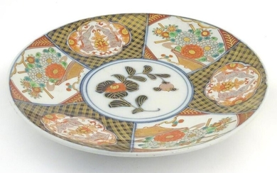 A Japanese Imari charger with panelled decoration