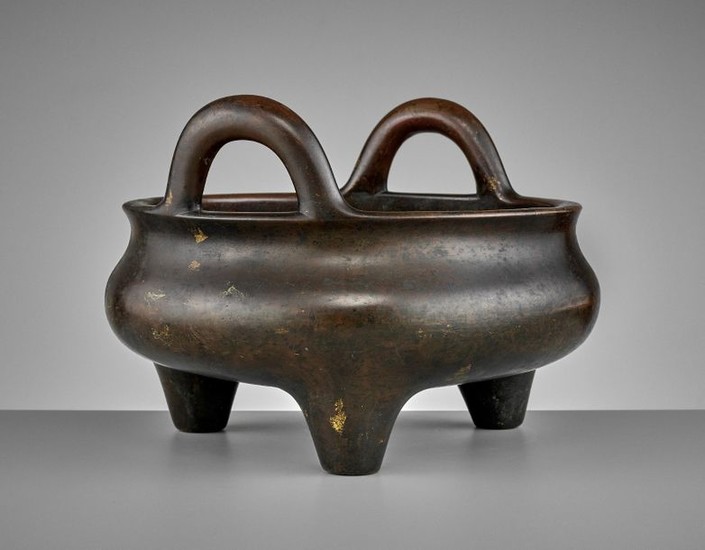 A LARGE AND HEAVILY CAST BRONZE TRIPOD CENSER,...