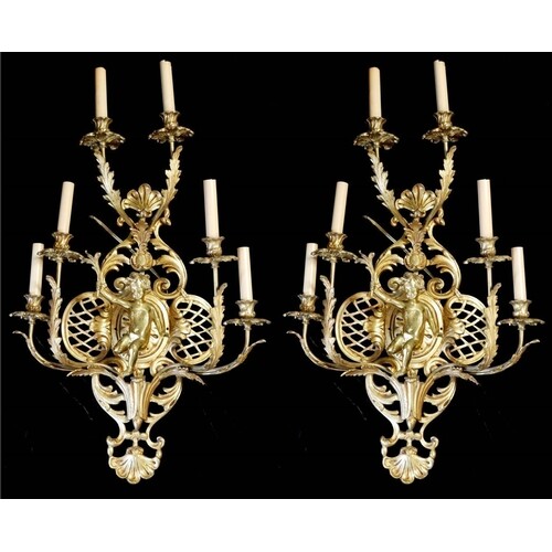A LARGE PAIR OF EARLY 20TH CENTURY POLISHED BRASS SIX BRANCH...