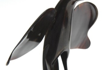 A MID-CENTURY PENGUIN FIGURE HORN ON WOODEN STAND