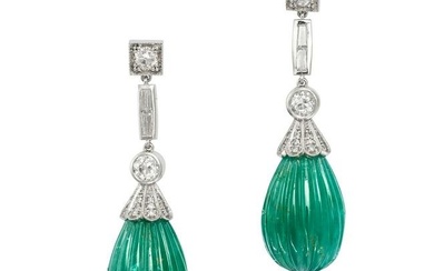 A PAIR OF CARVED EMERALD AND DIAMOND DROP EARRINGS in platinum, each set with a row of old and ba...